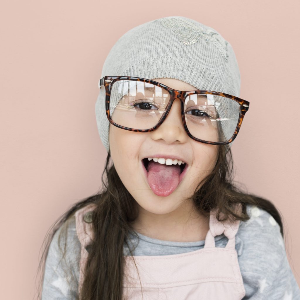 Studio portrait of a girl wearing glasses